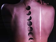 AXELL pubblica “SAILOR MOON” feat. SACKY a back of a person with a tattoo